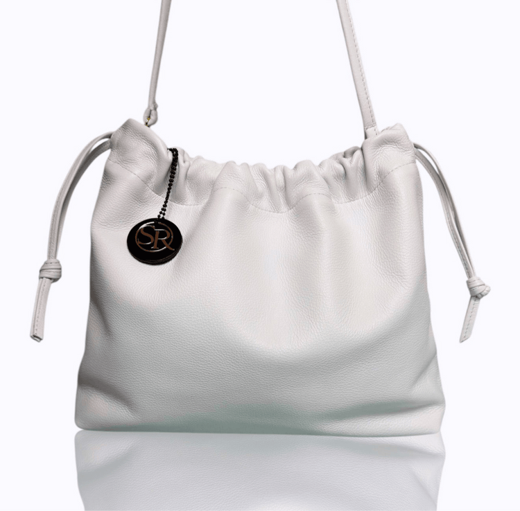 White leather drawstring bag from the Cocteau Collection with clean lines and matte finish