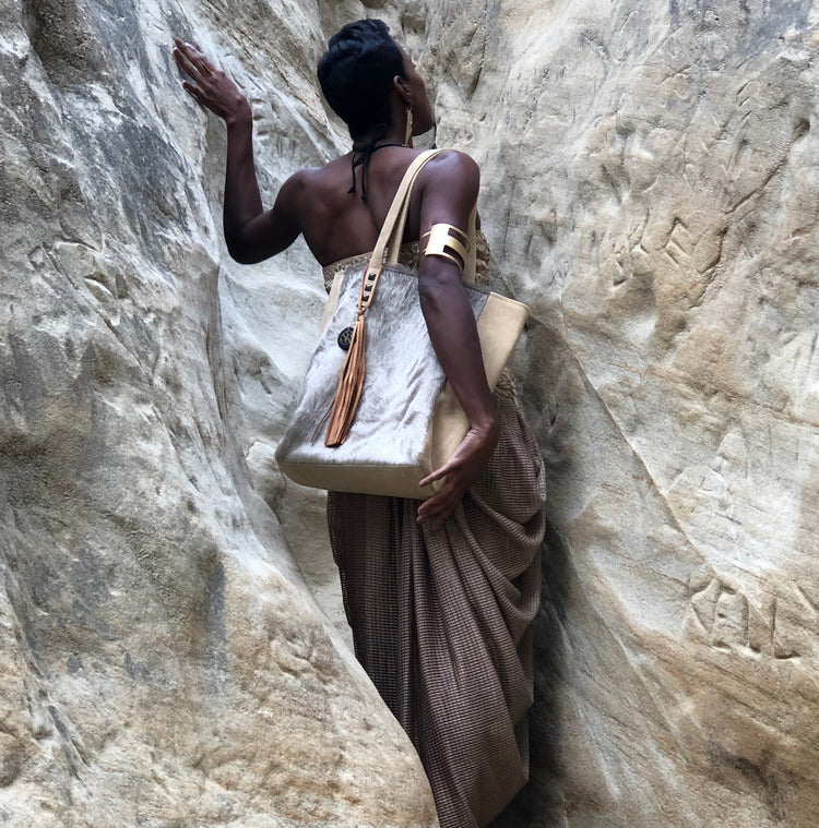 Discover the Siouxsie Tote — roomy, sleek, and handcrafted from premium hide or leather with tassel & stud details. Perfect for work or play.