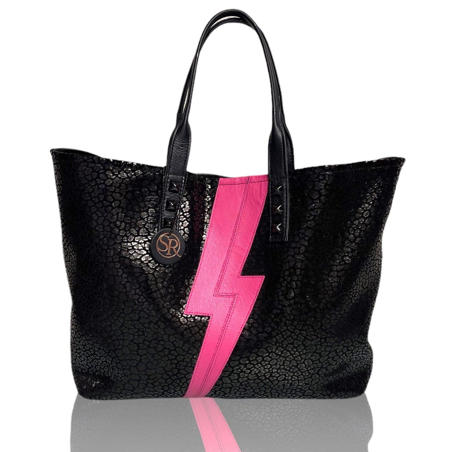 Step into glam rock with the Ziggy Collection — iridescent androgynous handbags inspired by Bowie’s alter ego, handcrafted with celestial embellishments.